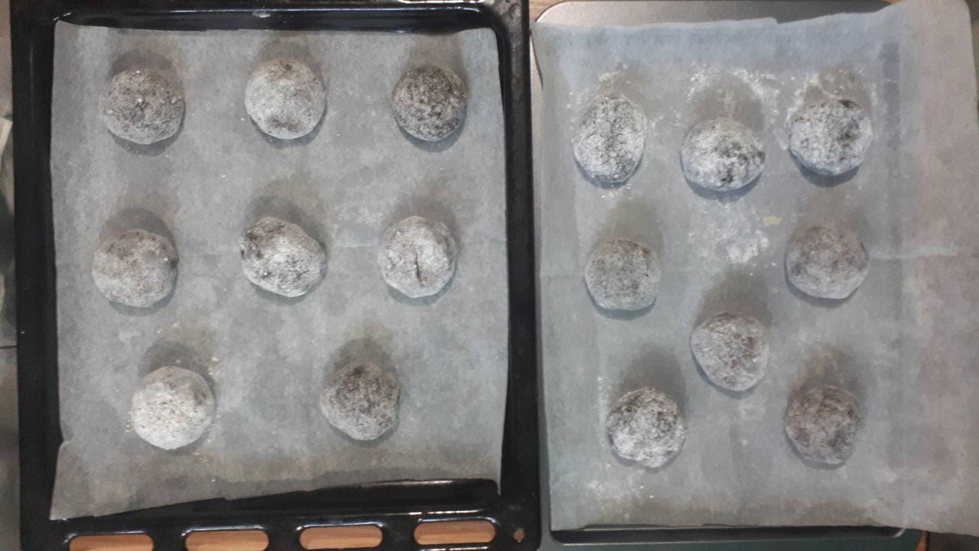 Chocolate mixture, scooped, coated with sugar, and placed in baking trays line with baking sheet