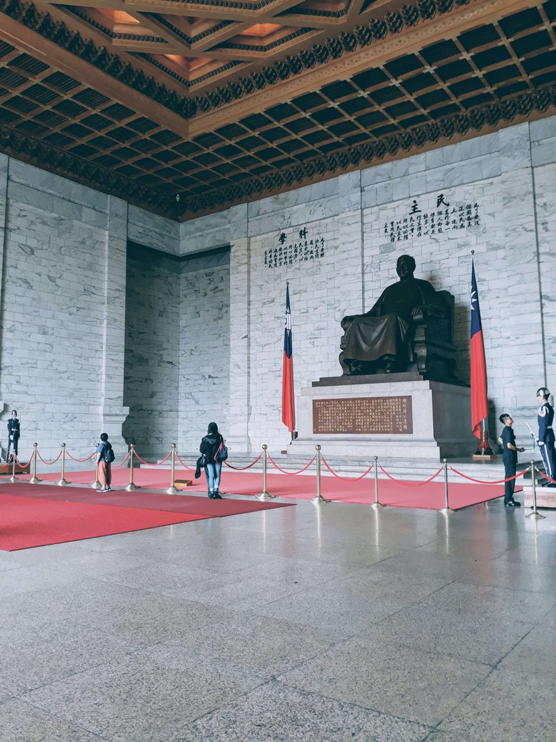 Inside Chiang Kai Shek's Main Memorial hall, his large bronze statue smiles at the visitors as they enter