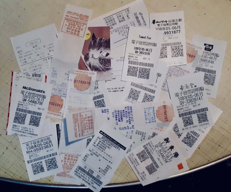 receipts laid out randomly on a table